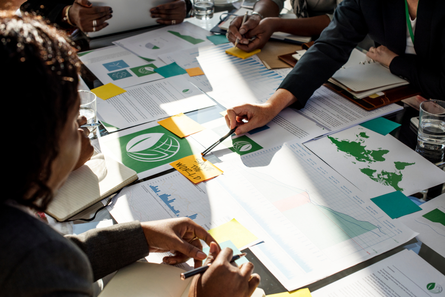 A Group of Business People in a Meeting about Environment